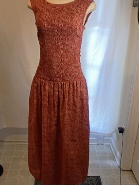 Universal Rust-Red Smocked Maxi Dress with Subtle Print